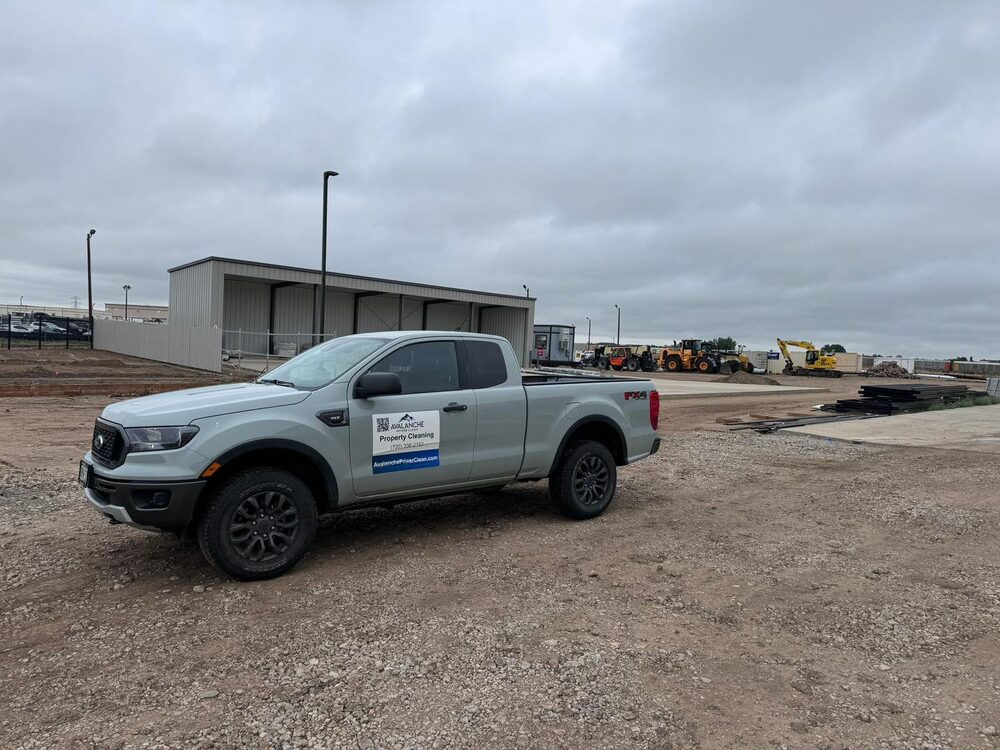 Avalanche Power Clean truck and trailer at a construction site